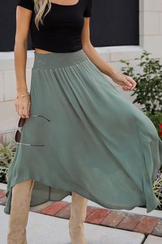 If you have iconic intentions, then the Sensational Purpose Olive Midi Skirt is the perfect look to achieve them! Designed with a flattering high-waisted fit, this skirt gracefully drapes to a midi length, creating a beautiful, flowing silhouette that moves with you. The rich olive hue adds a sophisticated, earthy tone that pairs beautifully with both neutrals and vibrant colors, making it a versatile addition to any closet. Crafted from lightweight, breathable fabric, this skirt offers a soft, High Waist Skirt With Elastic Band, Relaxed High Waist Skirt With Elastic Waistband, High Waist Skirt With Elastic Waistband And Relaxed Fit, Summer Flowy Flared Draped Skirt, Solid Color Summer Skirt With Banded Waist, Spring Skirt With Banded Waist, Chic Flowy Skirt With Wide Waistband, Spring Stretch Skirt With Banded Waist, Spring Skirt With Banded Waist And Stretch