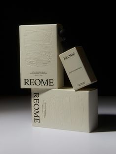 three boxes stacked on top of each other in the shape of recome books