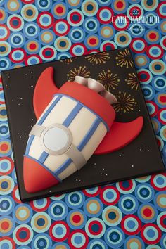 a cake that is shaped like a rocket ship