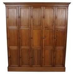 a large wooden cabinet with many doors and drawers