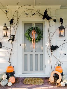 the front door is decorated with halloween decorations