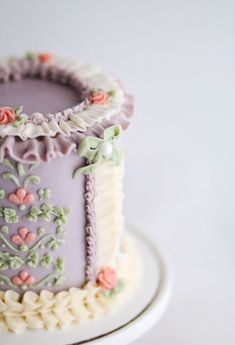 a decorated cake sitting on top of a white plate