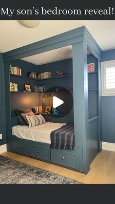 a bedroom with blue walls and built - in bookshelves is featured on this page