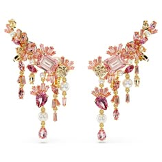 With their beautiful cascading design, these dramatic clip earrings are inspired by Japan’s national cherry blossom flower. Each gold-tone plated piece is crafted with a mix of fancy cut crystals and Swarovski Zirconia in vibrant shades of pink and champagne. For maximum glamour, the articulated style ensures each stone reflects the light throughout the day. Wear these earrings alone to embrace nature-infused beauty, or pair with a matching piece from our exquisite Gema Sakura jewelry family. Gold And Pink Earrings, Sakura Jewelry, Chandelier Flower, Concept Jewelry, Cherry Blossom Jewelry, Pink And Champagne, Glamour Jewelry, Dope Jewelry Accessories, Cherry Blossom Flower