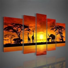 an elephant and two giraffes in the sunset