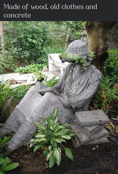 an image of a statue in the middle of a garden with plants growing out of it