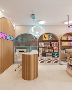 the inside of a pet store with shelves and dog food on display in it's center