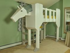 there is a horse shaped bunk bed in the room