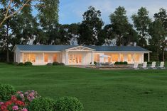 a rendering of a house in the middle of a field with flowers and trees around it