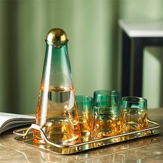 a tray with glasses and a decanter on it