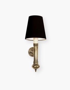 a wall light with a black shade on the top and bottom part of it's arm