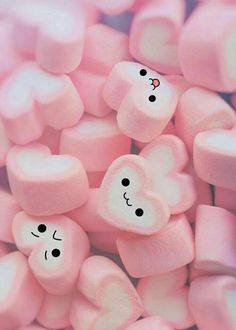 marshmallows with faces drawn on them in the shape of hearts and eyes