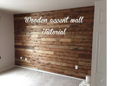 an empty room with wood accent wall and white lettering that reads wooden accent wall tutorial