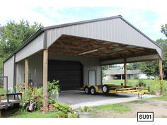 a large metal building with a garage attached to it