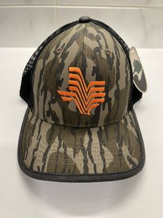 Get your hands on this rare Mossy Oak Whatatexas Whataburger Camo Trucker Adjustable Cap Hat. Perfect for casual occasions, this hat features a camouflage pattern with the iconic Whataburger logo on the front. It is made of durable polyester material and comes in one size that fits all. The hat also has an adjustable feature that allows you to customize the fit according to your preference. This Trucker Hat is a must-have for any collector or fan of Mossy Oak and Whataburger. Don't miss the chance to own this unique item. Camo Hat, Mossy Oak, Polyester Material, Hands On, Camouflage, Caps Hats, Trucker Hat, Camo, Accessories Hats