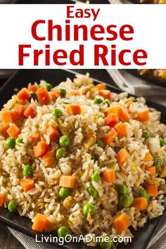 an easy fried rice dish with carrots and peas on a black plate in front of other dishes