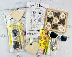 an assortment of crafting supplies including sunglasses and paper hearts