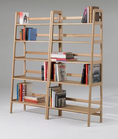 a wooden book shelf with books on it