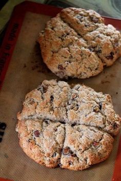 two cookies sitting on top of a cookie sheet