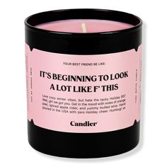 a pink candle that says it's beginning to look like a lot like this