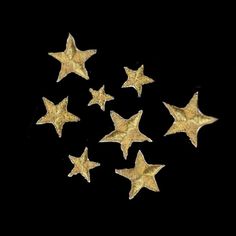 five gold stars on a black background