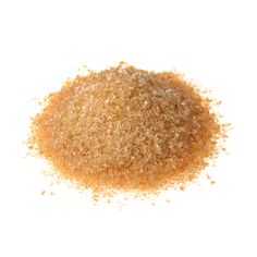 a pile of brown sugar sitting on top of a white table