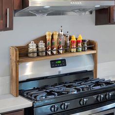 an oven with spices and condiments on it