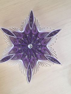 an ornament made out of paper on a table