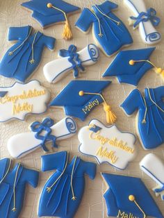 graduation cookies decorated with royal blue and white icing