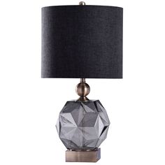 a glass table lamp with a black shade on the base and a silver metal base