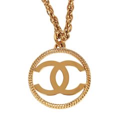 This vintage Chanel necklace of 24K gold plated metal has a large signature CC pendant on a long woven rope chain and box tab closure. Origin: FranceCollection: 1982Condition: Vintage; Excellent. Minor signs of wear, including light brushing, faint pitting, and some areas of color loss near the closure.Accompanied by: Chanel boxMeasurements: 18" chain, 2.25" x 2.25" pendant Classic Pendant Necklace, Chanel Box, Chanel Necklace, Burberry Shoes, Cc Logo, Vintage Chanel, Gold Pendant Necklace, Fendi Bags, Rope Chain