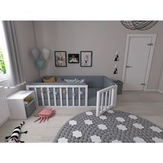 a baby's room is decorated in gray and white