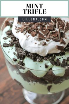 mint trifle dessert in a glass dish with whipped cream and chocolate chips