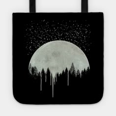 a black and white tote bag with trees in the foreground, stars above it