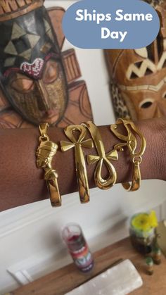 "Beautiful 18k Gold African Statement Bracelets. The perfect African adornment for any Goddess in your life.  You have a choice of FOUR options for purchasing: 1) SET OF ALL THREE Bracelets 2) QUEEN NEFERTITI Bracelets 3) ANKH BANGLE Bracelets 4) EYE OF RA BANGLE Bracelets  * The ankh bangles is NOT adjustable. the width of opening is 2.7\" so if you have tiny wrist, this isn't a good option for you.  Be sure to store in a dry and cool space. All orders come with a polishing cloth to keep your a Egyptian Bracelet, Secret Message Bracelet, Afrocentric Jewelry, Statement Bracelets, African Gifts, Eye Of Ra, Queen Nefertiti, Earthy Jewelry, Custom Initial Necklace