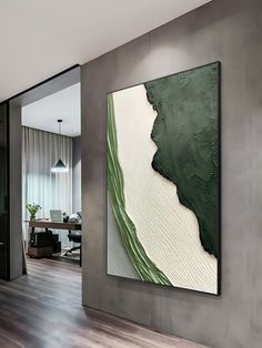 an abstract painting hangs on the wall next to a wooden floor in a modern home