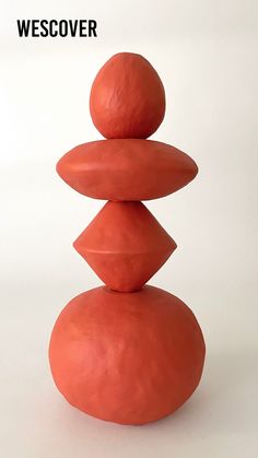 a stack of rocks sitting on top of each other in front of a white background