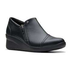 Combine comfort and a classic wearable everyday design with these Clarks women�s Suttyn slip-on shoes. Crafted from leather, they have a 2.75-inch wedge heel, the brand�s signature cushioning and a breathable footbed, plus a zip closure. Wear them with anything from jeans or pants to your favorite dress.Features: ComfortClosure Type: ZipperShoe Heel Height: 2 3/4 InchesUpper/Outer Base Material: 100% Full Grain LeatherShoe Lining Material: TextileSole Material Content: 100% Thermoplastic-RubberT Leather Slip-ons With Removable Insole And Wedge Heel, Modern Slip-ons With Slip-resistant Round Toe, Modern Slip-ons With Round Toe And Slip-resistant, Slip-on Workwear Boots With Cushioned Footbed, Modern Slip-resistant Slip-ons With Round Toe, Slip-on Work Boots With Removable Insole, Leather Low-top Heels, Slip-resistant Flat Heel Slip-ons, Modern Slip-ons With Round Toe Medium Width