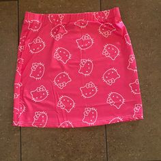 This Pink Hello Kitty Pencil Skirt Is Super Adorable And Adds A Fun Touch To Any Outfit. It Is Pink With White Outlines Of Hello Kitty Faces. Cute Mini Skirt For School, Cute Mini Skort With Lined Skirt, Cute White Skort For School, Cute Mini Length Lined Skort, Kawaii Fitted Mini Length Bottoms, Y2k Pink Bottoms For School, Pink Y2k Style Bottoms For School, Y2k Style Pink Bottoms For School, Cute Pleated Mini Skirt