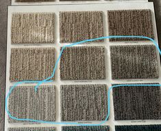 several different shades of carpet on top of each other with blue lines in between them