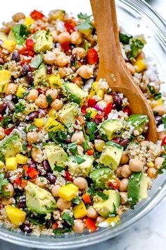 a glass bowl filled with vegetables and rice