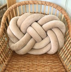 a wicker basket with a large knot on it