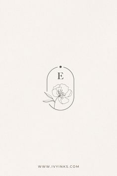 the letter e is inscribed with a flower in it's center and surrounded by leaves