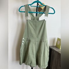 Light Green Overall Shorts, Super Soft Material With Adjustable Straps! Never Worn. Size Small. 3.5 Inch Inseam On The Shorts, 12in Width Across Middle Of Chest, 15.5in Width Across Waist, 14.5 In Length Of Shorts From Waist. Straps Are Adjustable Green Cotton Overalls, Casual Green Shortalls With Pockets, Casual Cotton Overall Shorts, Green Overall Shorts, Green Overalls, Green Jumpsuit, Overall Shorts, Soft Material, Light Green