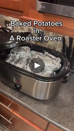 a video demonstrating how to make baked potatoes in an electric roaster oven on the counter