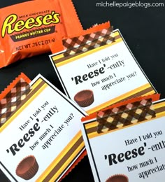 reese's candy bar wrappers are sitting next to each other on a table