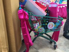 a shopping cart filled with lots of gifts