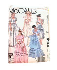 "Please click \"Learn More About Item\" in description to read it in its entirety before purchasing. Lovely vintage misses' gown/dress and skirt pattern by McCall's circa 1984, pattern no. 8914. \"Gown and dress (all views) have fitted, underlined bodice, back zipper closing, and separate, gathered half-slip with side opening. View A, B, and C have scoop neckline and short sleeves with gathered cap and sleeve heads. Gown A has tiered skirt and sleeves with elastic in lower casings. Gown B has gathered skirt. Dress C has gathered skirt with over ruffle. B and C are for border lace or eyelet only. Sleeveless gown D and dress E have gathered skirt and capelet-type collar. All views are worn with purchased ribbon tie belt.\" Pattern is complete, uncut, factory folded, and in excellent conditio Petite Gowns, 1980s Prom Dress, Mccalls Dress, 1980s Prom, Mccalls Patterns Dress, Border Lace, Tiered Skirts