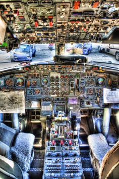 the inside of an airplane with many controls