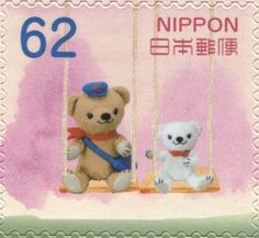 a postage stamp with two teddy bears on swings and the number 522 is written in chinese